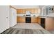 Well-lit kitchen featuring wood cabinets and modern appliances and plenty of counter space at 4439 Yellow Harbor St, Las Vegas, NV 89129