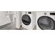 Modern white washer and dryer set with sleek black accents and laundry area at 4439 Yellow Harbor St, Las Vegas, NV 89129
