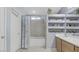 Well-organized bathroom with a bathtub, shower, and built-in shelving at 482 Painted Sage Ct, Henderson, NV 89015