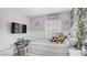 Pink themed bedroom with a television, musical keyboard, and comfortable seating at 482 Painted Sage Ct, Henderson, NV 89015