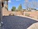 A backyard with a large patio paver surface and block wall at 486 Stonegate Meadow Ave, Las Vegas, NV 89178