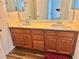 Bathroom vanity featuring dual sinks and wood cabinets at 486 Stonegate Meadow Ave, Las Vegas, NV 89178