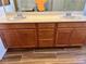 Bathroom vanity featuring dual sinks and wood cabinets at 486 Stonegate Meadow Ave, Las Vegas, NV 89178