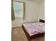 Bedroom with carpet, window with blinds, and a bed with a floral comforter at 486 Stonegate Meadow Ave, Las Vegas, NV 89178