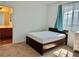 Neutral bedroom with a single bed, white walls, carpet, and view of bath at 486 Stonegate Meadow Ave, Las Vegas, NV 89178