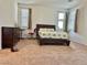 Spacious bedroom features carpeted floors, neutral paint, and windows providing natural light at 486 Stonegate Meadow Ave, Las Vegas, NV 89178
