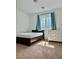 Neutral bedroom with a single bed, white walls, carpet, and a dresser at 486 Stonegate Meadow Ave, Las Vegas, NV 89178