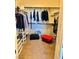 Walk-in closet with clothes rack, storage shelves and containers at 486 Stonegate Meadow Ave, Las Vegas, NV 89178
