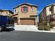Charming two-story home with a brown garage door and a blue van parked in front at 486 Stonegate Meadow Ave, Las Vegas, NV 89178