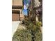 Well-maintained landscaping adorns the front of this home at 486 Stonegate Meadow Ave, Las Vegas, NV 89178