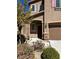 Charming two-story home with a landscaped front yard and inviting entrance at 486 Stonegate Meadow Ave, Las Vegas, NV 89178