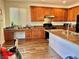 Well-lit kitchen with wooden cabinets, granite countertops, and a gas range at 486 Stonegate Meadow Ave, Las Vegas, NV 89178