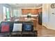 Open-concept kitchen flows into living area, featuring granite island and modern appliances at 486 Stonegate Meadow Ave, Las Vegas, NV 89178
