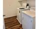 Laundry room featuring modern washer and dryer on wood-look tile flooring at 486 Stonegate Meadow Ave, Las Vegas, NV 89178