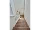 Carpeted staircase with white railing leading to the upper level of the house at 486 Stonegate Meadow Ave, Las Vegas, NV 89178