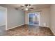 Bedroom features tile flooring and a sliding glass door at 6075 Belvedere Canyon Ave, Las Vegas, NV 89139
