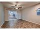 Bedroom features tile flooring and a sliding glass door at 6075 Belvedere Canyon Ave, Las Vegas, NV 89139