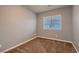 Bedroom featuring neutral walls, carpet and a window at 6075 Belvedere Canyon Ave, Las Vegas, NV 89139