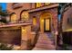 Close-up of stone archway over the entrance leading to an attractive front door at 6075 Belvedere Canyon Ave, Las Vegas, NV 89139