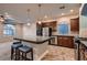 Modern kitchen with stainless steel appliances, granite countertops and an island with stool seating at 6075 Belvedere Canyon Ave, Las Vegas, NV 89139