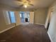 Bedroom with carpet flooring, ceiling fan, and a view into other rooms at 6800 E Lake Mead Blvd # 1018, Las Vegas, NV 89156