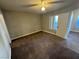 Bedroom with carpet flooring, ceiling fan, and a window with natural light at 6800 E Lake Mead Blvd # 1018, Las Vegas, NV 89156