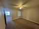 Bedroom with neutral paint and carpet, window with blinds, and ceiling fan at 6800 E Lake Mead Blvd # 1018, Las Vegas, NV 89156