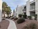 Well-maintained condo community featuring mature trees and desert landscaping at 6800 E Lake Mead Blvd # 1018, Las Vegas, NV 89156