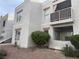 Exterior view of an apartment complex with balconies and landscaped grounds at 6800 E Lake Mead Blvd # 1018, Las Vegas, NV 89156