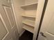 A view of a storage closet with shelving and dark flooring at 6800 E Lake Mead Blvd # 1018, Las Vegas, NV 89156