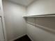 Walk-in closet with neutral paint and carpet, and plenty of shelving at 6800 E Lake Mead Blvd # 1018, Las Vegas, NV 89156