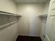A walk-in closet with shelving and dark flooring at 6800 E Lake Mead Blvd # 1018, Las Vegas, NV 89156