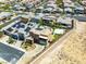 A modern home with a pool, sport court, desert landscaping and a view of the community at 7222 Pulsar Mesa Ct, Las Vegas, NV 89148