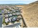 View of a new community, backing to a desert landscape with mountain views in the distance at 7222 Pulsar Mesa Ct, Las Vegas, NV 89148