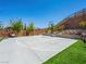 Well-maintained basketball court, set against a backdrop of landscaped greenery and mature trees at 7222 Pulsar Mesa Ct, Las Vegas, NV 89148
