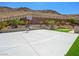 Full basketball court with professional lines, complemented by lush landscaping and mountain views at 7222 Pulsar Mesa Ct, Las Vegas, NV 89148