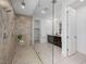 Modern bathroom featuring a seamless glass shower with multiple shower heads, bench and dual sink vanity at 7222 Pulsar Mesa Ct, Las Vegas, NV 89148