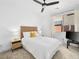 Calm bedroom with a ceiling fan, natural light, and white bedding at 7222 Pulsar Mesa Ct, Las Vegas, NV 89148