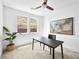 Bright bedroom featuring a modern ceiling fan, an art piece, and natural light from two windows at 7222 Pulsar Mesa Ct, Las Vegas, NV 89148