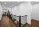 Hallway with wood floors offers a modern design, leading to other spaces at 7222 Pulsar Mesa Ct, Las Vegas, NV 89148