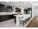 Modern kitchen with dark cabinetry, white countertops, stainless steel appliances, and a stylish island at 7222 Pulsar Mesa Ct, Las Vegas, NV 89148