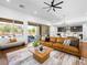 Open-concept floor plan featuring dining and living areas flowing to an outdoor patio at 7222 Pulsar Mesa Ct, Las Vegas, NV 89148