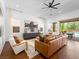 Neutral living room with hardwood floors, an area rug, and natural lighting at 7222 Pulsar Mesa Ct, Las Vegas, NV 89148