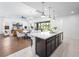 Bright, open-concept design with kitchen island, dining area, and living room, perfect for entertaining at 7222 Pulsar Mesa Ct, Las Vegas, NV 89148