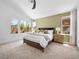 Light-filled main bedroom with large windows offering backyard views and modern decor at 7222 Pulsar Mesa Ct, Las Vegas, NV 89148