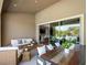 Cozy covered patio featuring comfortable seating and a dining table, perfect for outdoor relaxation and entertaining at 7222 Pulsar Mesa Ct, Las Vegas, NV 89148