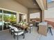 Covered patio with an outdoor dining area and access to the pool, ideal for entertaining and relaxation at 7222 Pulsar Mesa Ct, Las Vegas, NV 89148