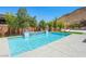 Sparkling pool with clean, modern lines and inviting steps, set in a serene backyard oasis at 7222 Pulsar Mesa Ct, Las Vegas, NV 89148