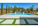 Backyard pool area with manicured landscaping and clean modern design, ideal for relaxation and recreation at 7222 Pulsar Mesa Ct, Las Vegas, NV 89148