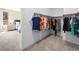 Spacious walk-in closet with ample hanging space and neutral carpeting located near a bedroom at 7222 Pulsar Mesa Ct, Las Vegas, NV 89148